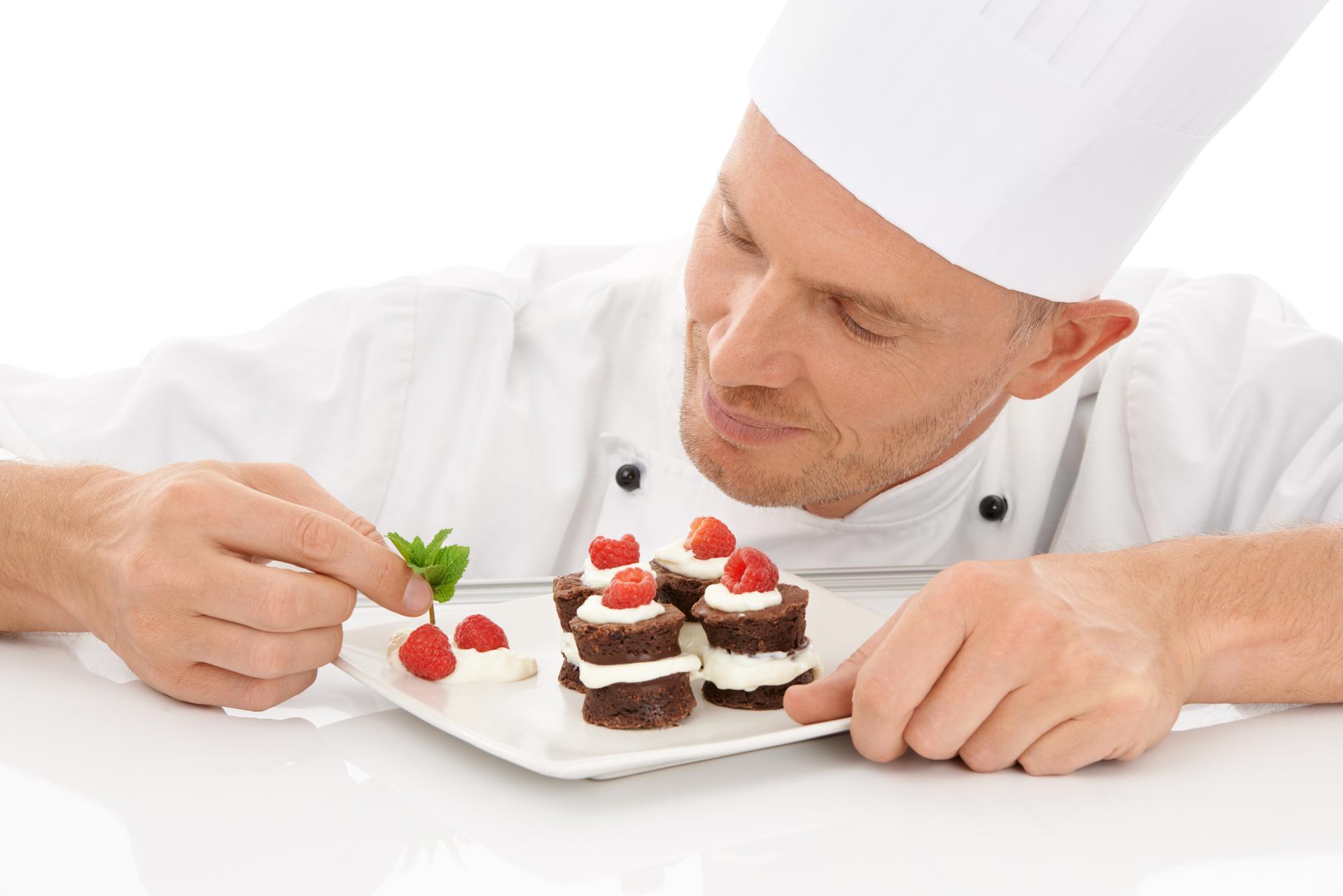 Workshop attendees plating desserts